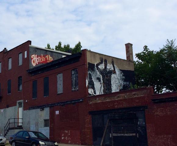 bal-hands-up-graffiti-pops-up-in-baltimore-201-001