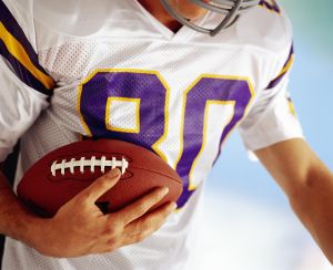 Football player carrying football