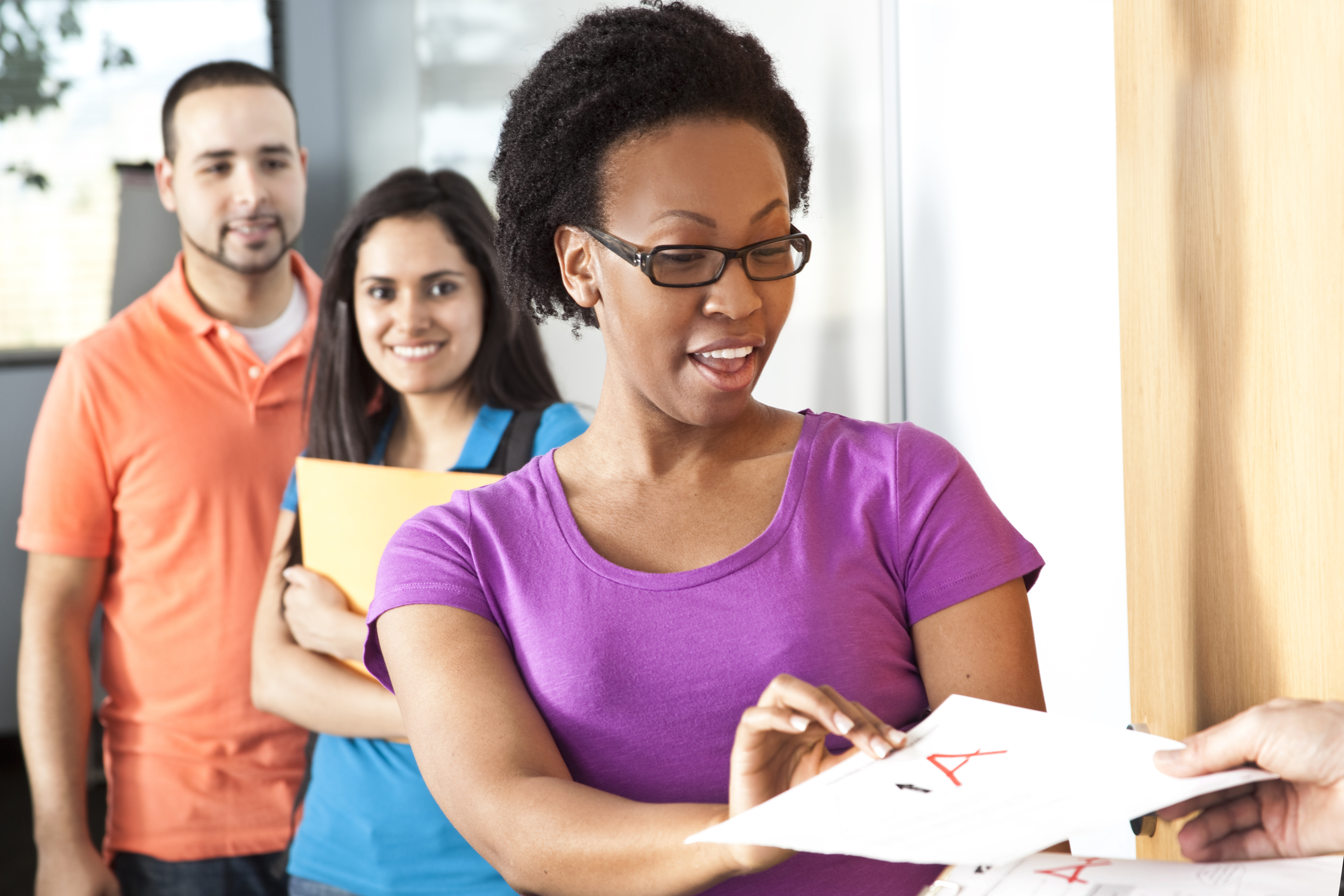 Education: Multi-ethnic group of college students in classroom.