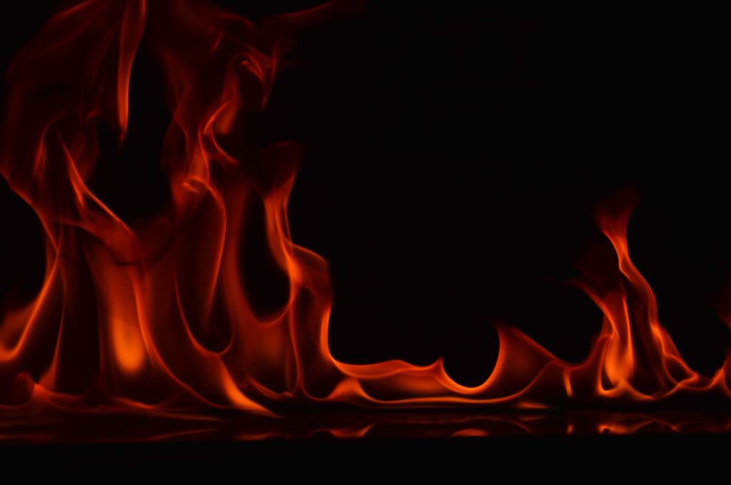 Close-Up Of Fire Against Black Background