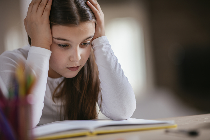 Little girl sick of homework