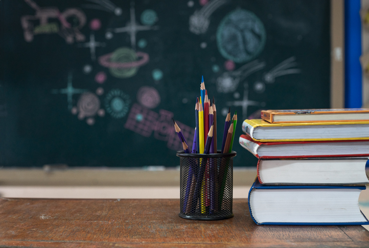 School books on desk, education concept