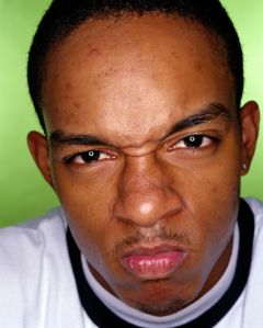 TEENAGE BOY (16-18) WITH ANGRY EXPRESSION, PORTRAIT