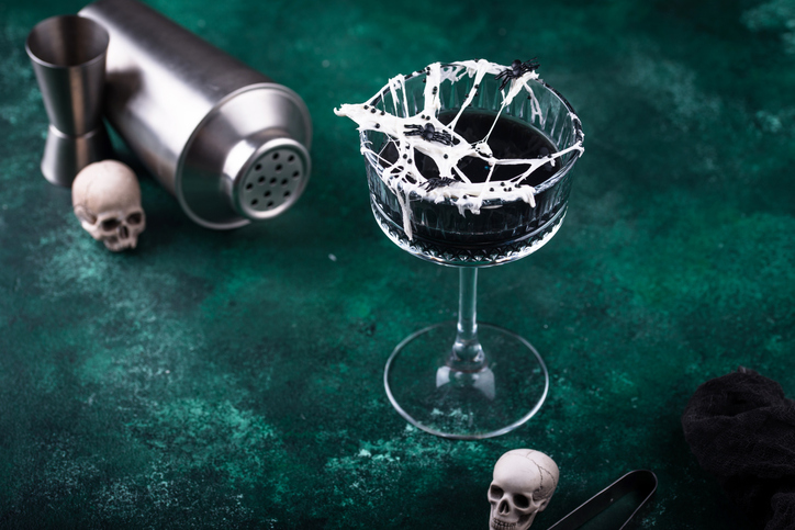 Halloween cocktail with spider cobweb