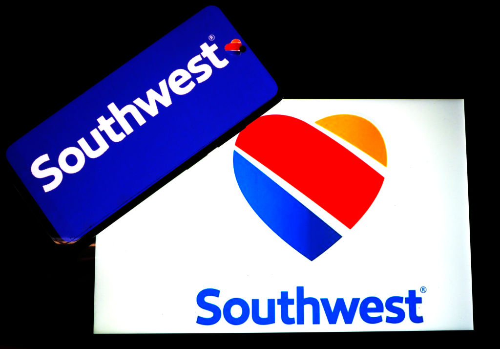 In this photo illustration, a Southwest Airlines logo seen...